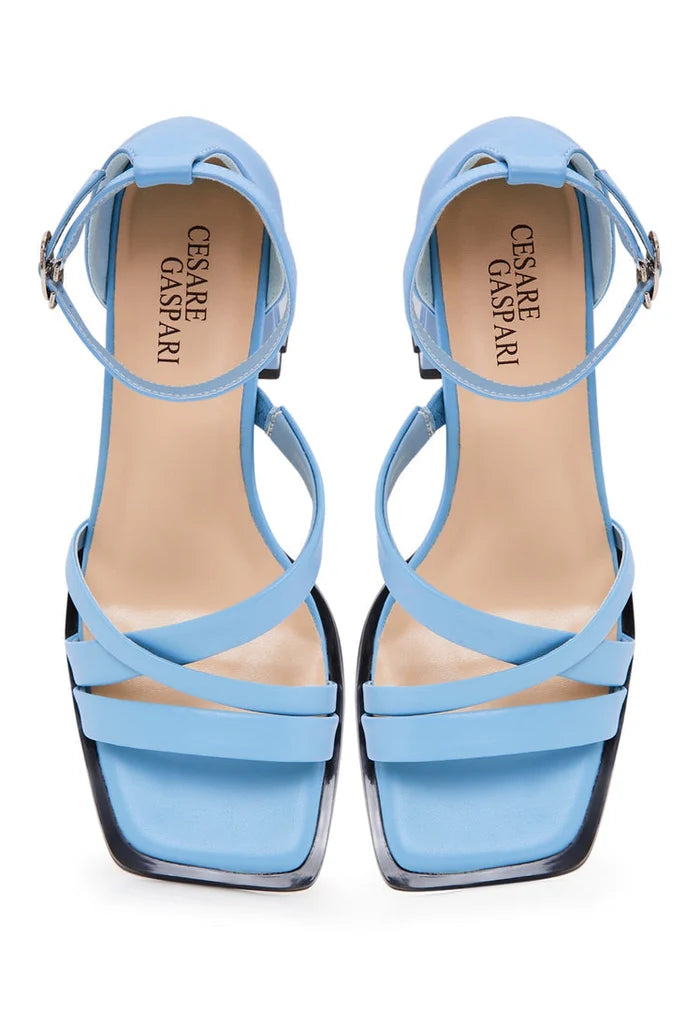 A fashionable image featuring women's open toe blue leather sandals with block heels, perfect for adding a touch of style to any outfit.