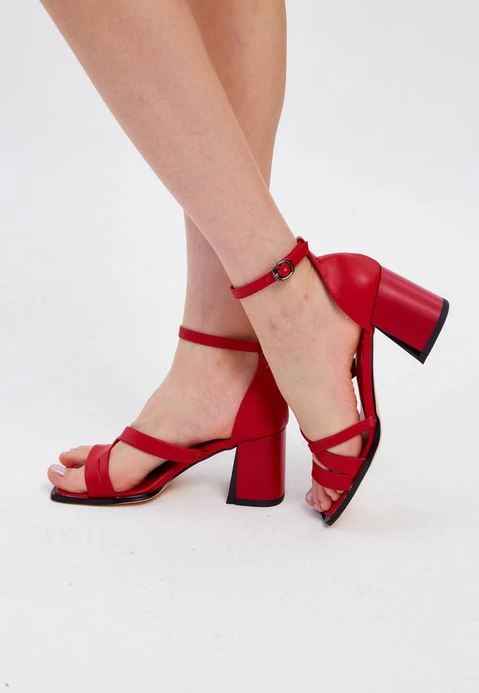 A pair of stylish red leather block heel open toe sandals, perfect for summer, in women's footwear fashion.