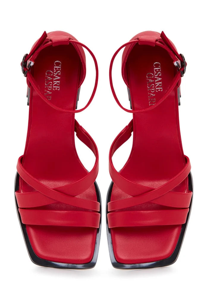 A pair of stylish red leather block heel open toe sandals, perfect for summer, showcasing trendy women's footwear.