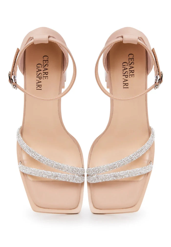 A pair of stylish beige open toe leather block heeled sandals, perfect for adding a touch of sophistication to any outfit.