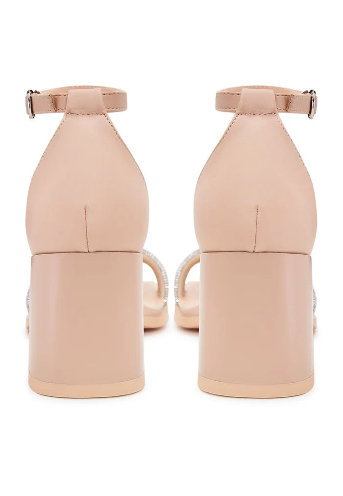 A pair of stylish beige open toe leather block heeled sandals perfect for any occasion.