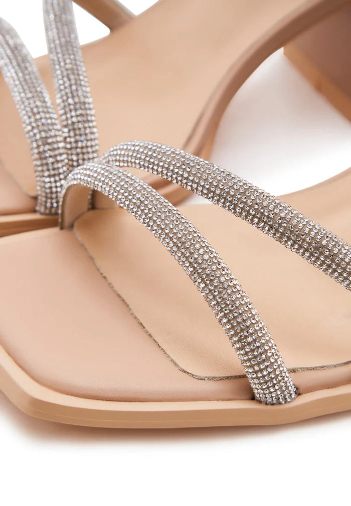 A stylish pair of beige open toe leather block heeled sandals perfect for any occasion.