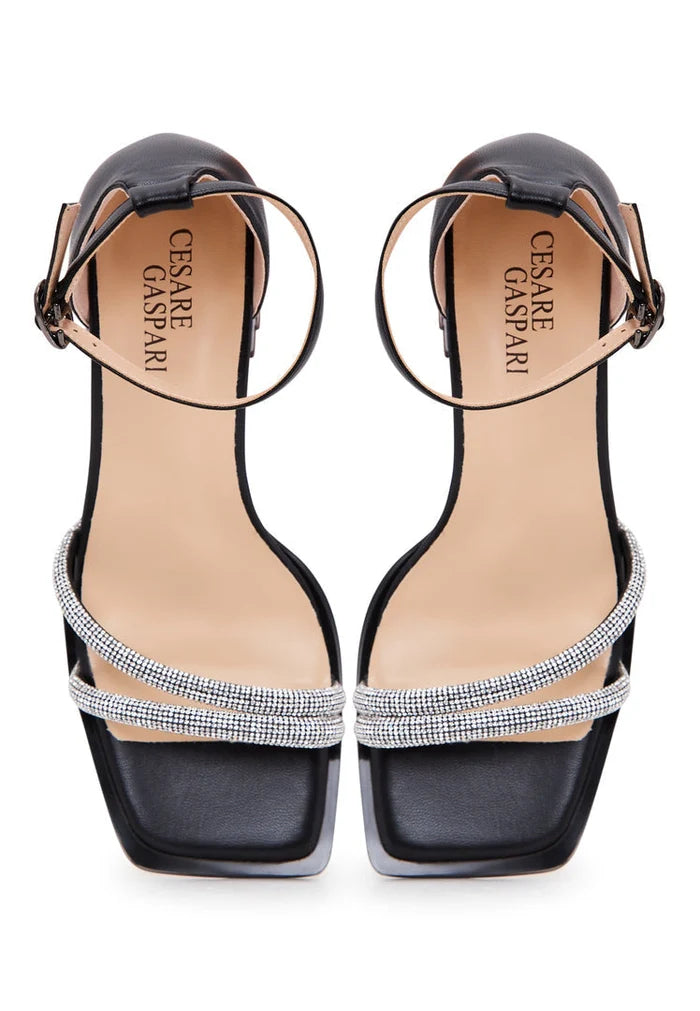 Stylish black leather block heel sandals with an open toe design, perfect for a chic and comfortable look.