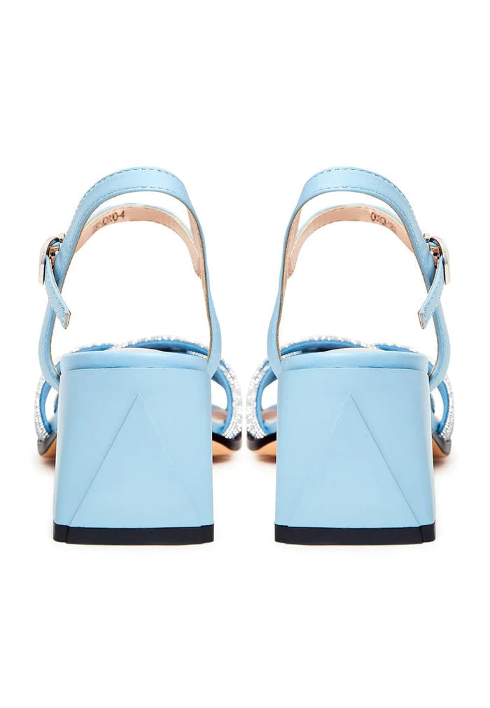 A stylish pair of blue leather sandals with block heels, featuring open toes, known as the Andrea sandals.