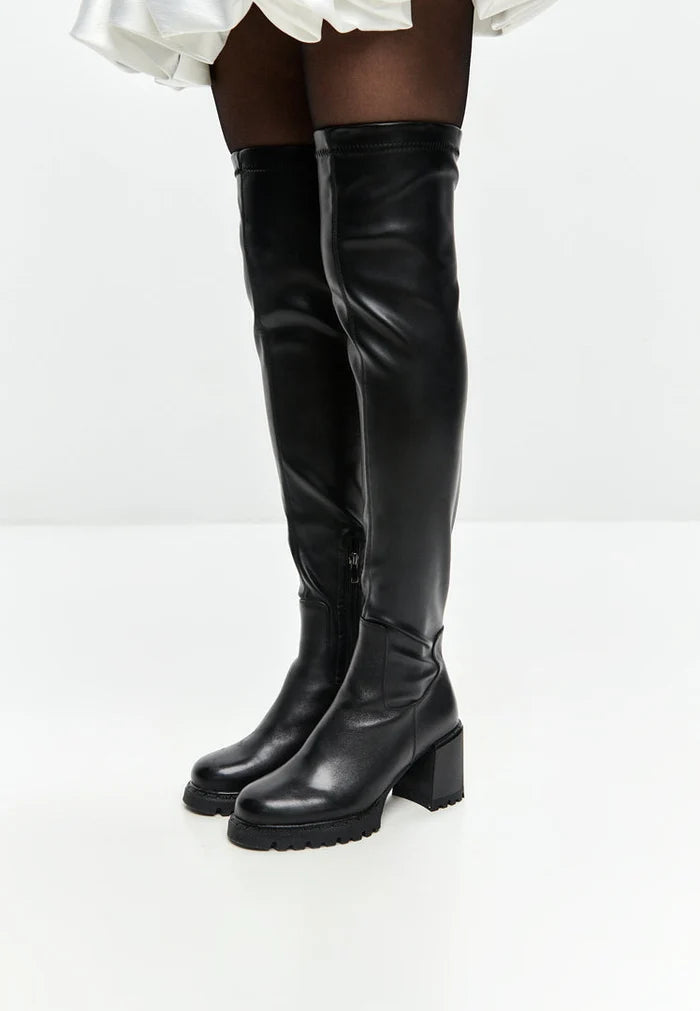 A stylish pair of black over the knee block heel boots, perfect for trendy women's fashion footwear.
