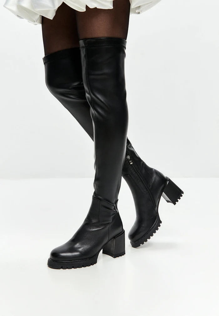 A stylish pair of black over the knee block heel boots - the perfect trendy women's fashion footwear for any outfit.