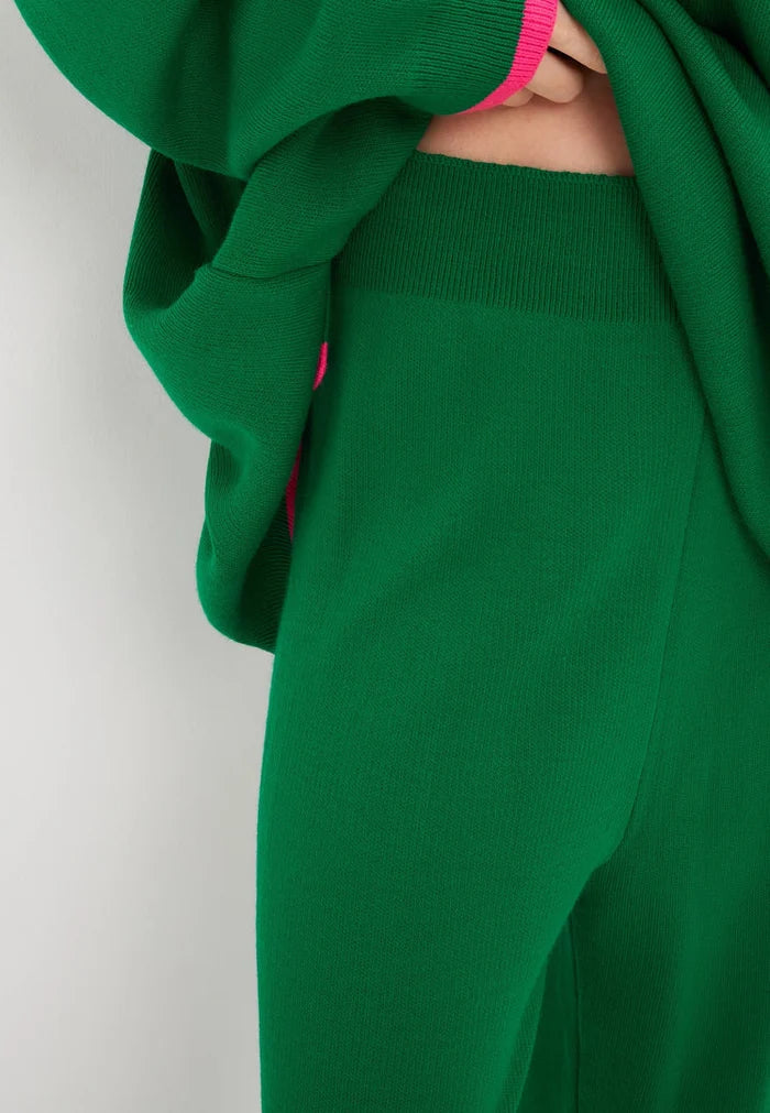 A trendy and cozy green oversized jogger set, including an oversized sweatshirt and matching joggers, perfect for lounging in style. Plus size loungewear for ultimate comfort.