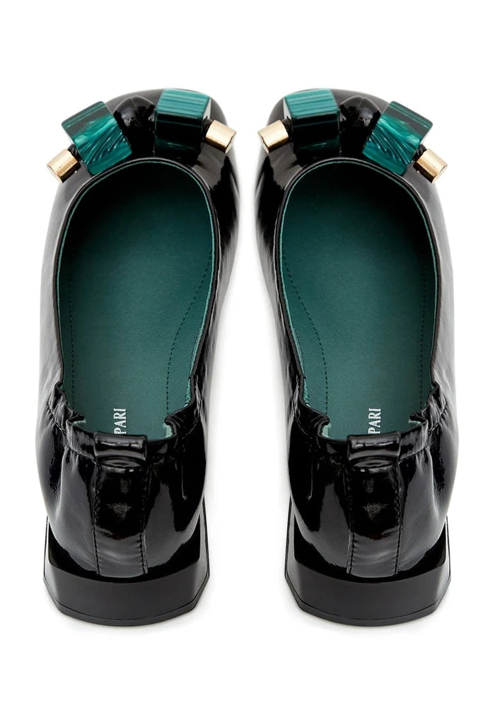 A stylish and elegant pair of patent leather ballet flats adorned with shimmering embellishments in classic black, perfect for any fashion-forward woman.