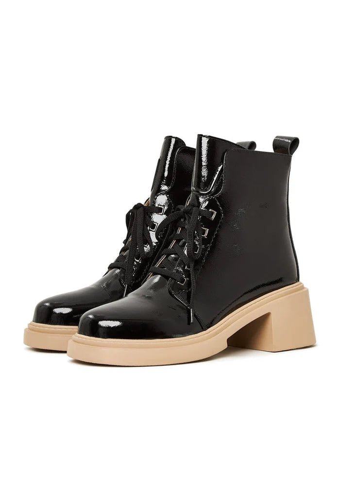 A stylish pair of black patent leather ankle boots with laces, perfect for women's fashion, crafted in classy patent leather footwear.
