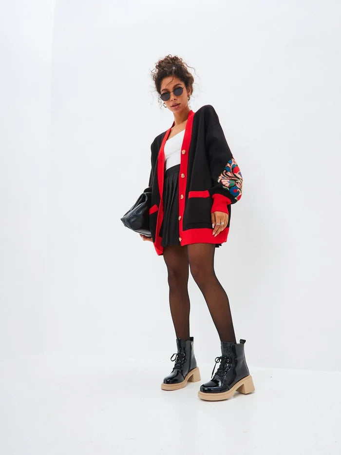 A stylish pair of black patent leather ankle boots for women featuring lace-up details, perfect for adding a touch of sophistication to any outfit.