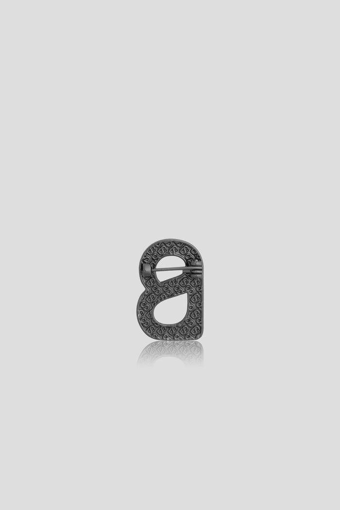 petite signature flat brooch in hematite by buttonscarves back view