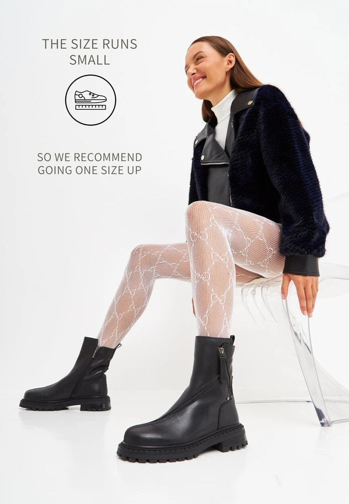A stylish pair of black leather platform ankle boots for women, featuring high heels.