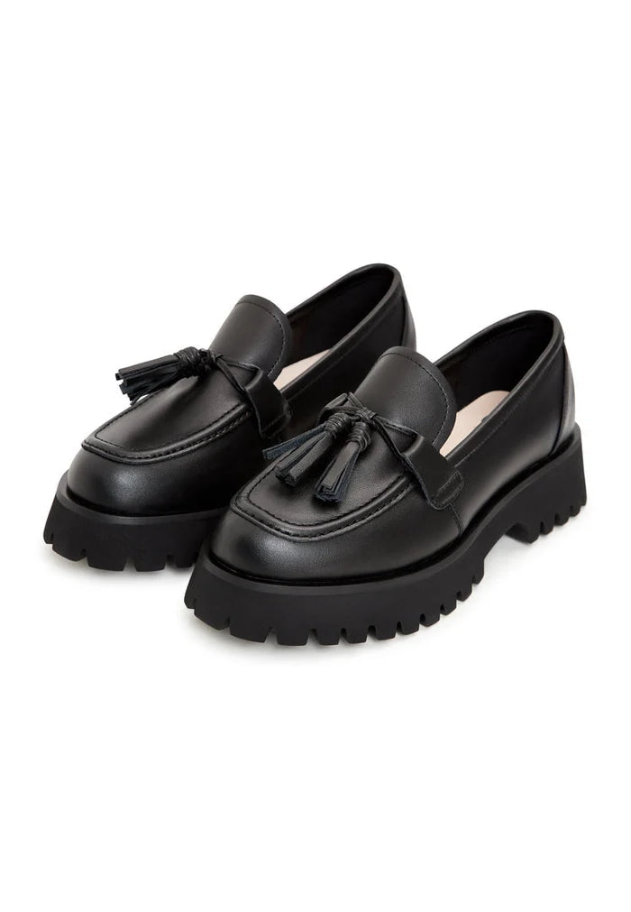 A stylish pair of black platform loafers with a chunky sole, known as Ksenia platform loafers, perfect for women looking for casual yet trendy footwear.