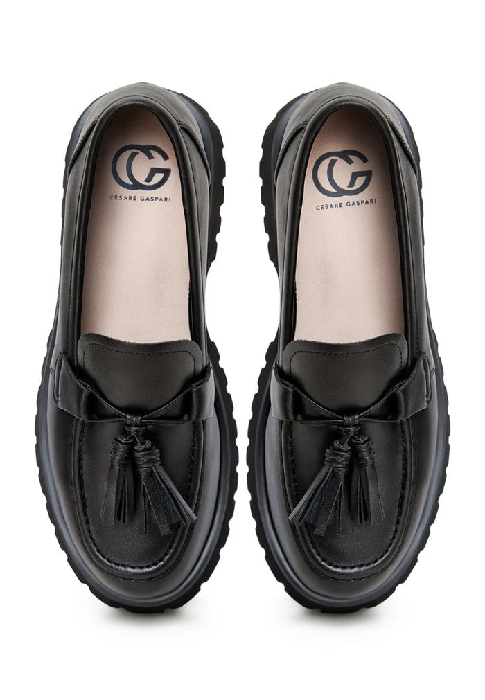 A stylish pair of Ksenia platform loafers in black, perfect for women seeking trendy chunky sole loafers for a casual look.