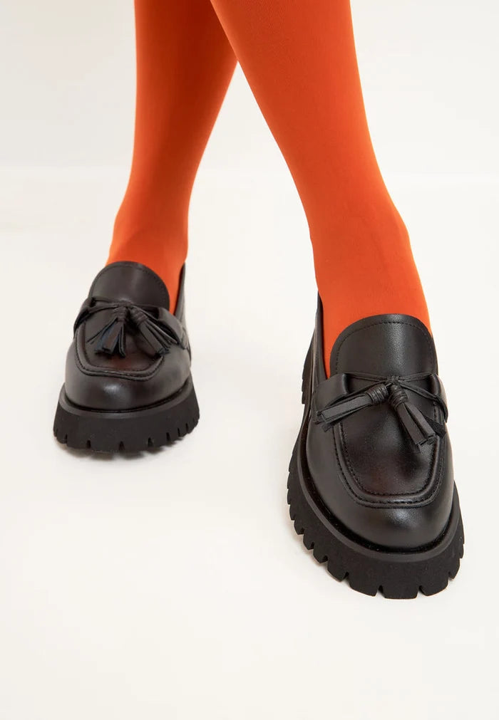 A stylish pair of black platform loafers, the Ksenia platform loafers are trendy women's platform shoes with a chunky sole, perfect for a casual and comfortable look.