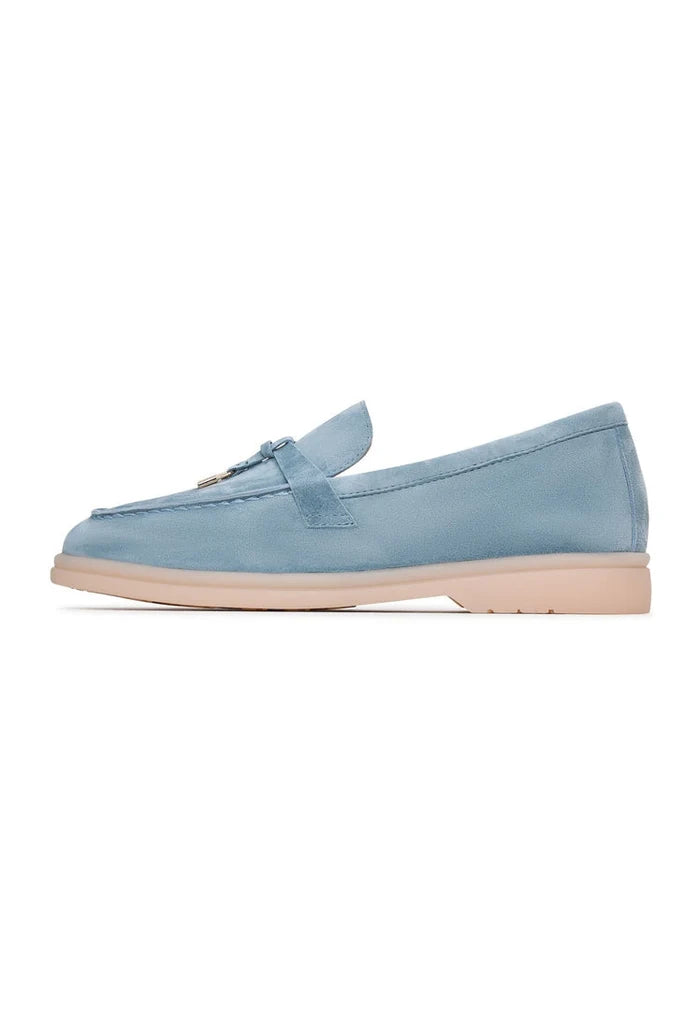 A pair of stylish blue Aurelia platform moccasins for women, perfect for stepping out in style.