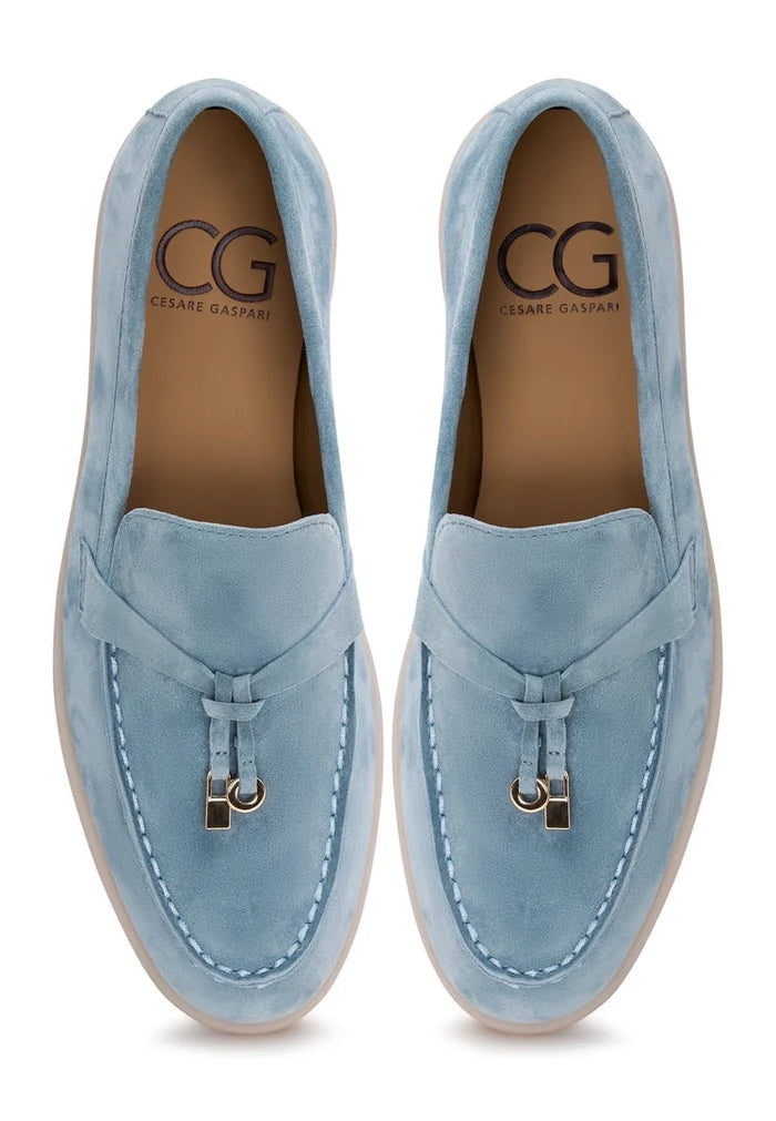 A pair of stylish blue platform moccasins by Aurelia Shoes for women, perfect for a fashionable and comfortable look.