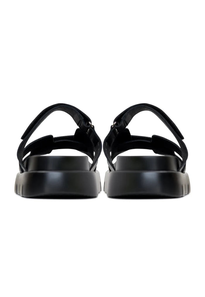 A stylish pair of black Kati platform mules with a trendy design perfect for any outfit.