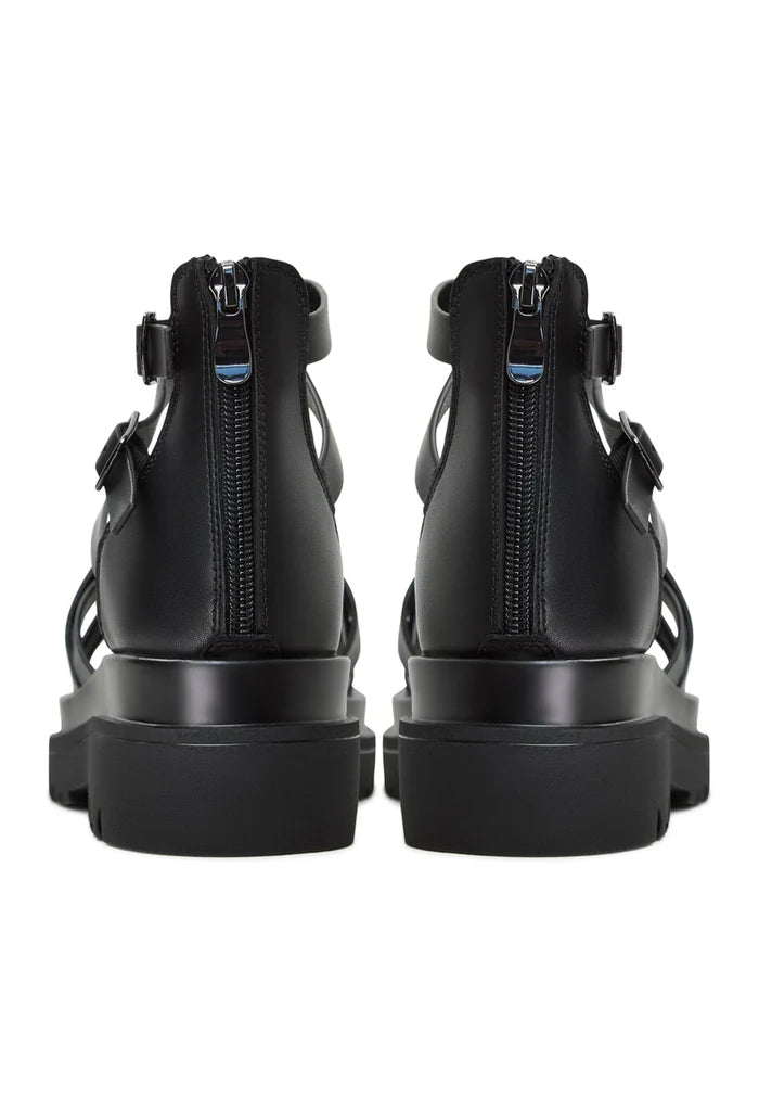 Back view of Tatiana Black Platform Sandals showcasing sleek zippers and stylish design, perfect for adding height and elegance. Buy Platform Sandals Tatiana Black for a chic and modern look.
