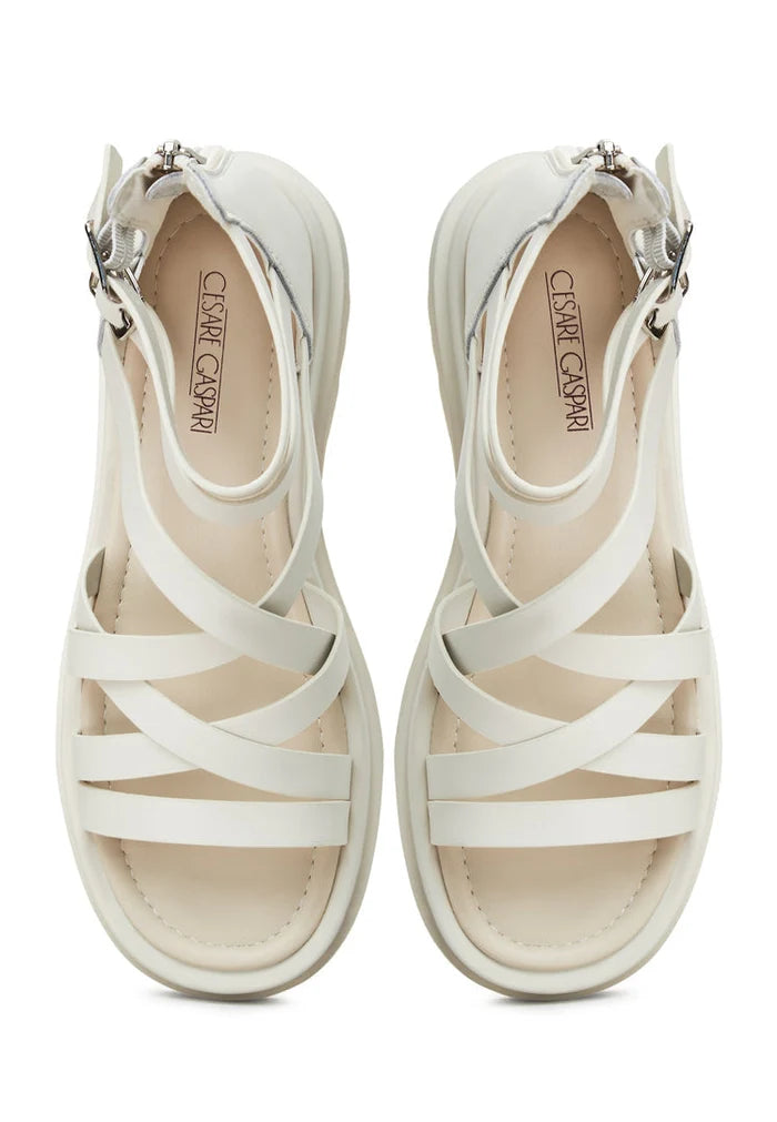 A fashionable pair of white platform sandals for women, featuring the Tatiana design with strappy details and wedge heels.