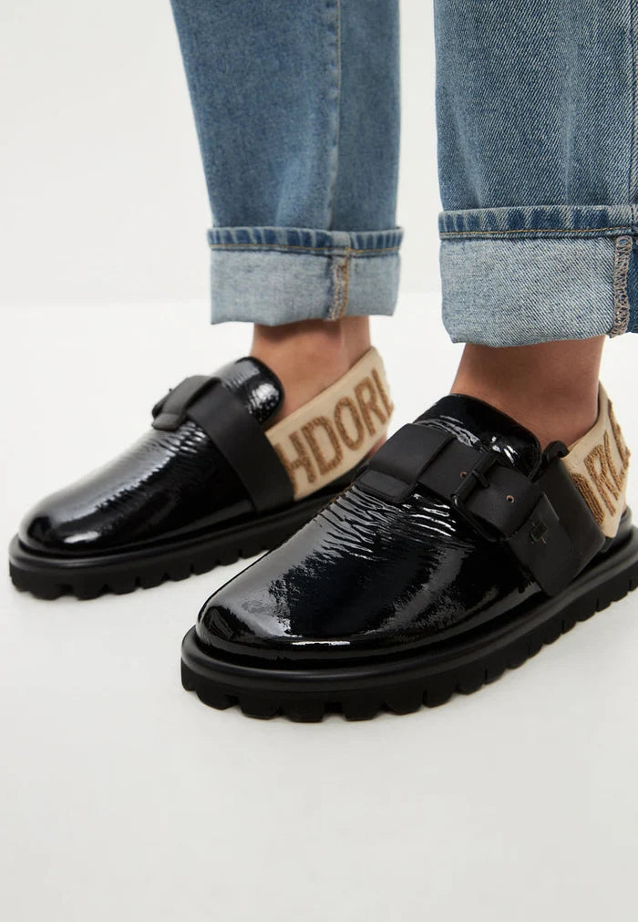 A stylish pair of women's black Renata platform slingback slippers.