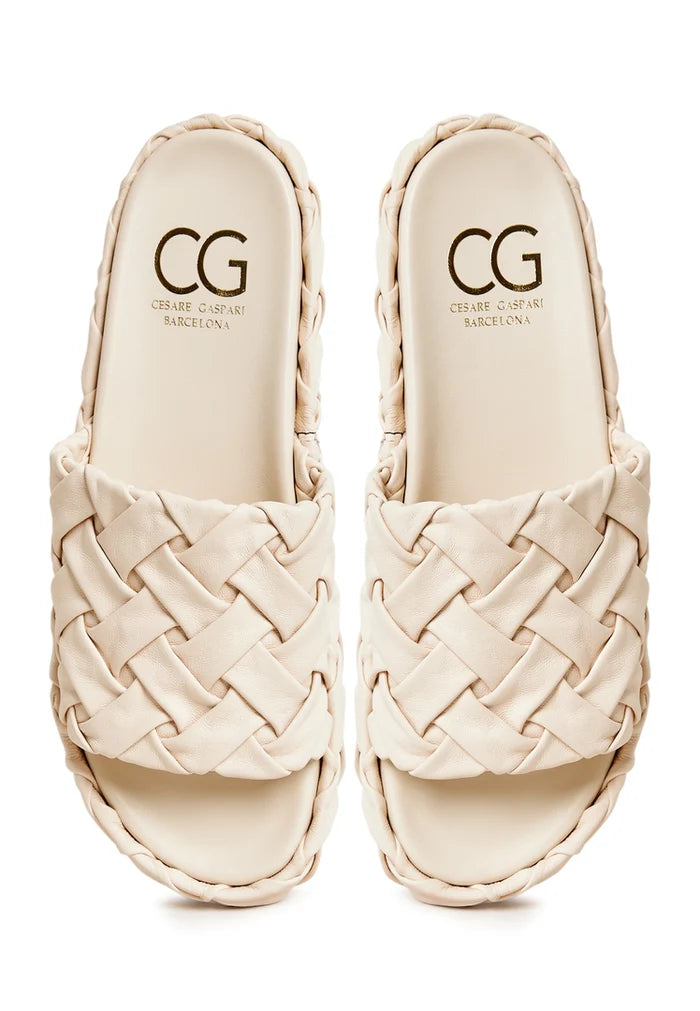 A fashionable pair of beige platform slippers, the Antonella platform sandals, perfect for women looking for trendy and stylish beige footwear.