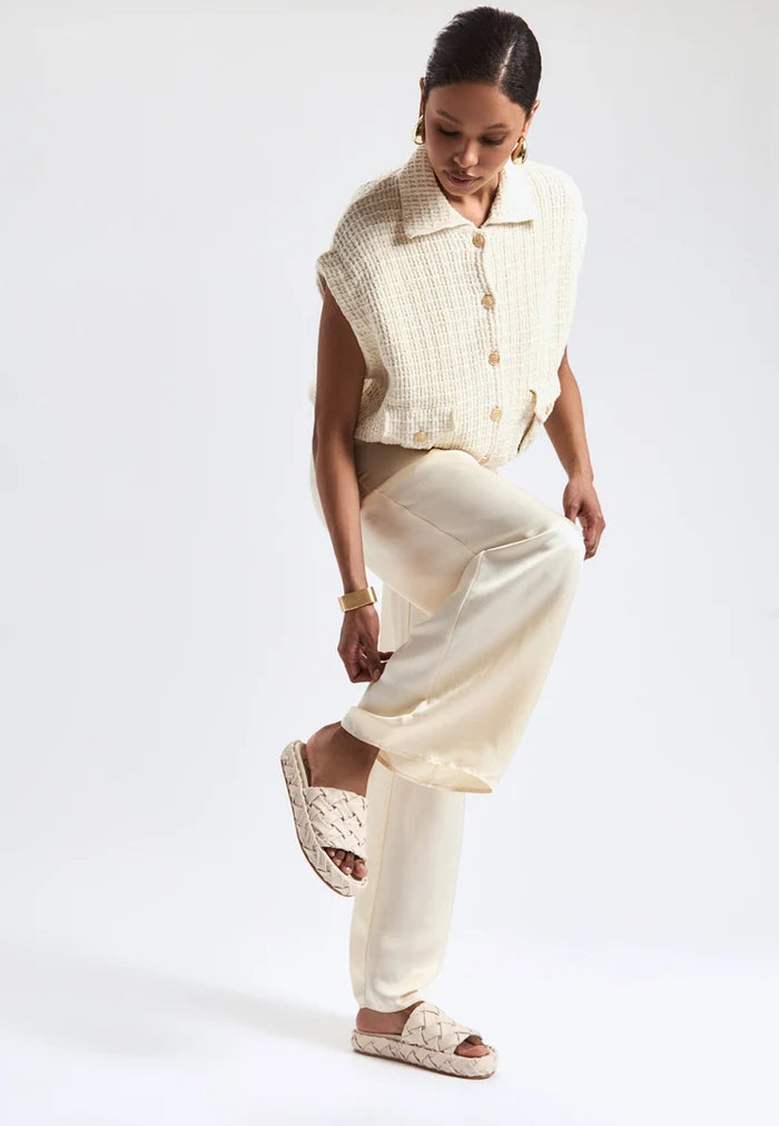 A pair of stylish beige platform slippers, known as Antonella platform sandals, for women - a trendy and fashionable choice in platform footwear.