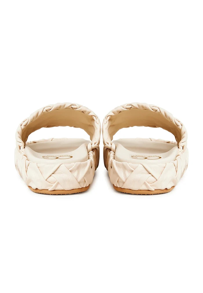 A close-up image of stylish beige platform slippers, the Antonella platform sandals for women, representing trendy and fashionable platform footwear.