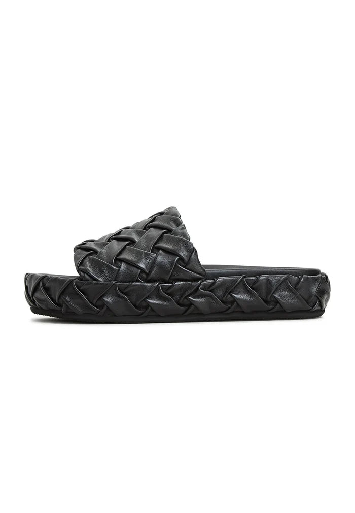 A trendy pair of Antonella Platform Slippers in classic black for women's fashion, ideal for slipping on and stepping out in style.