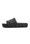 A trendy pair of Antonella Platform Slippers in classic black for women's fashion, ideal for slipping on and stepping out in style.