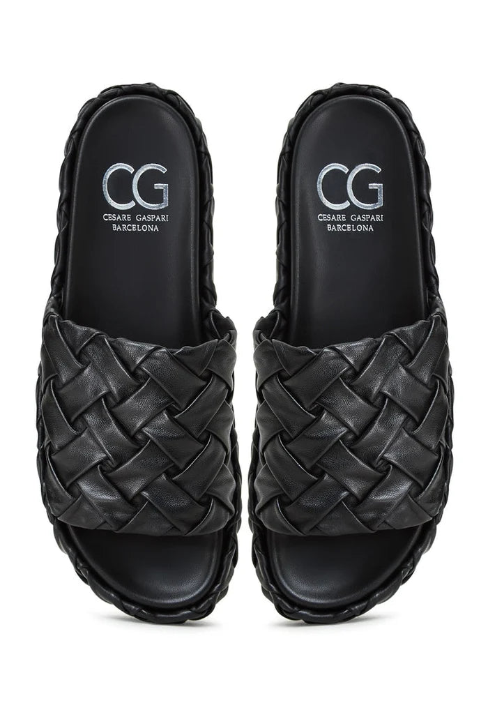 A stylish pair of black Antonella platform slippers, perfect for women looking for fashionable slip-on sandals.