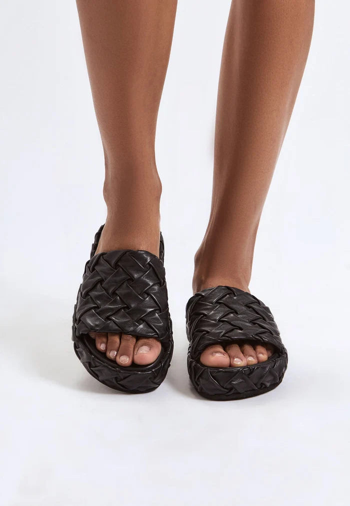 A chic pair of Antonella platform slippers in black, perfect for women looking for stylish slip-on fashion sandals.