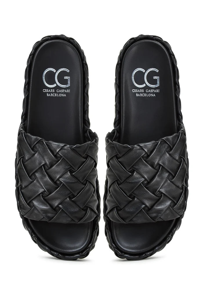 A stylish pair of Antonella black platform slippers for women, perfect as fashionable slip-on sandals.