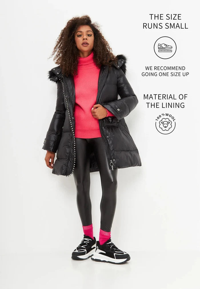 A pair of stylish black platform sneakers, perfect for the winter season. These warm and trendy fashion footwear are a must-have in any wardrobe.