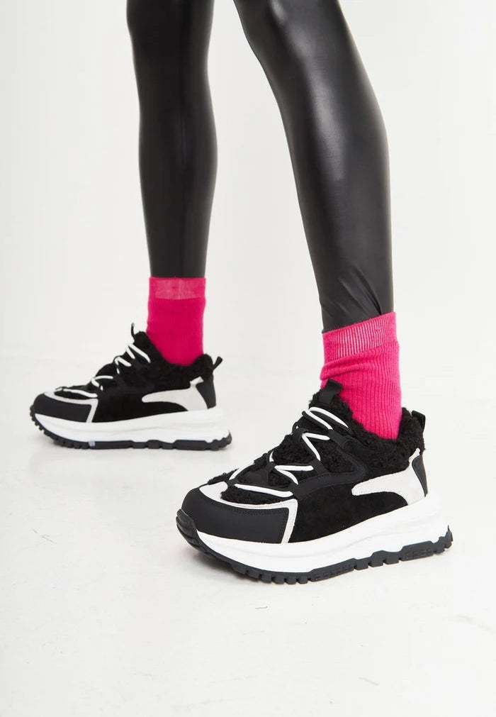 A stylish pair of black platform sneakers, perfect for those looking for warm and trendy fashion footwear.
