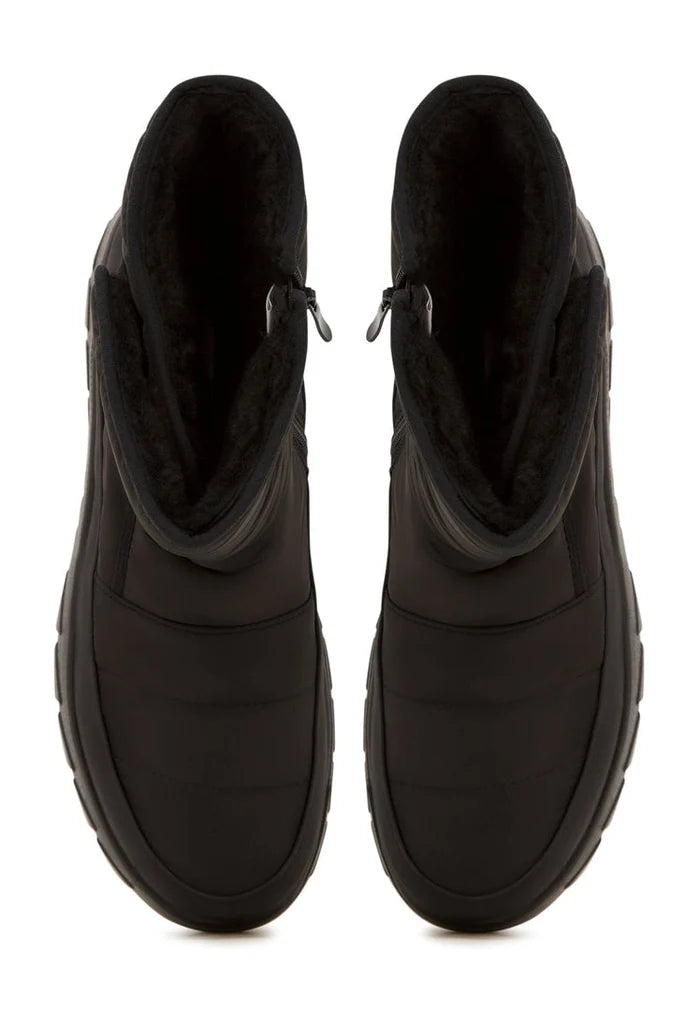 A pair of stylish platform winter boots for women, perfect for cold weather with their warm and cozy design.
