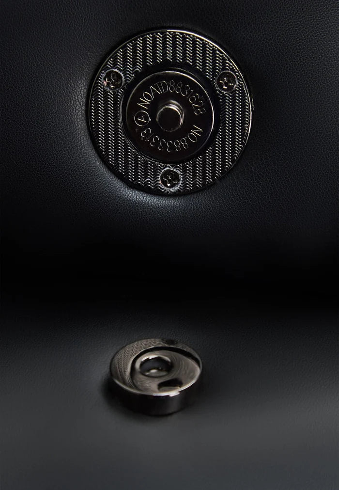 A stylish black quilted clutch bag that adds a touch of elegance to any outfit.