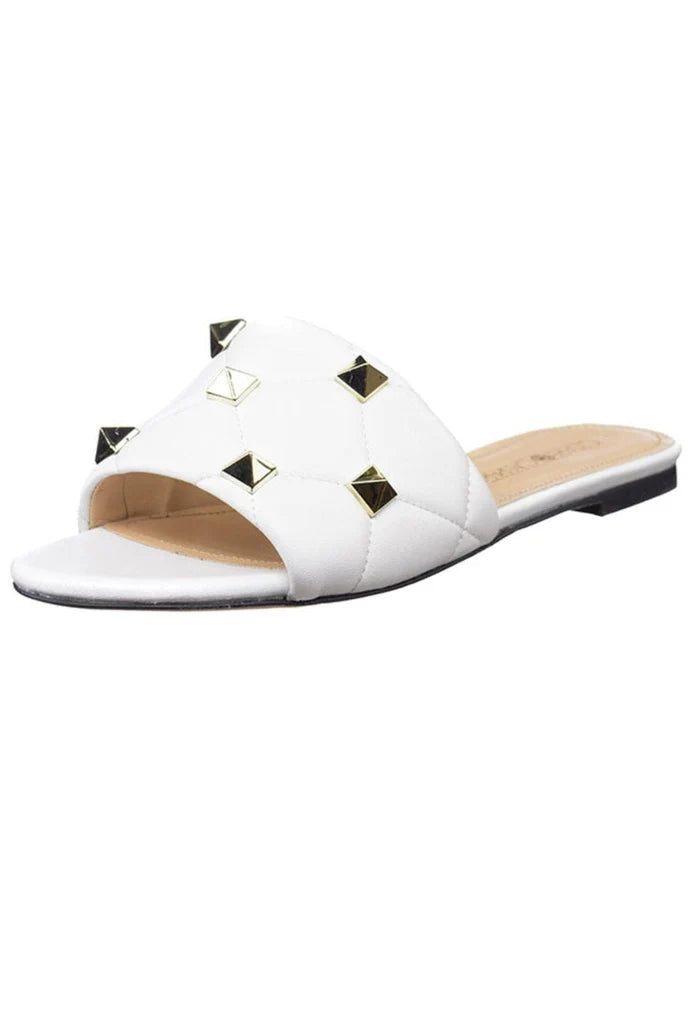 A close-up image of white Rockstud and Mila sandals.