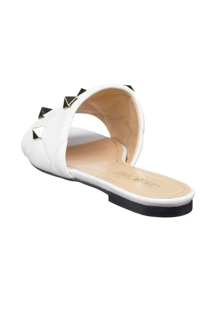 Stylish white Rockstud sandals and Mila sandals with edgy rockstud detailing, perfect for a chic summer look.