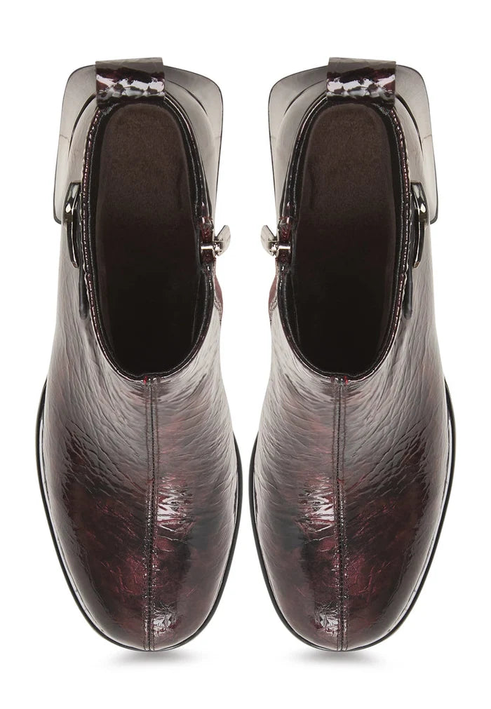 A stylish pair of women's Vika leather ankle boots in Bordeaux, featuring a sleek design.