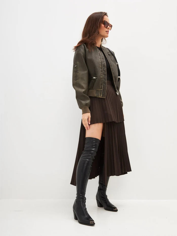 A close-up image of a pair of sleek leather knee-high boots with high heels, perfect for a stylish and sophisticated look.