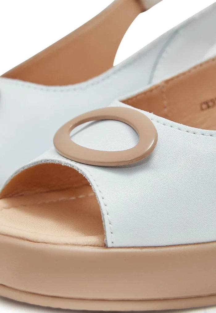 A stylish pair of white slip-on platform heel sandals, perfect for any fashionable woman's summer wardrobe.