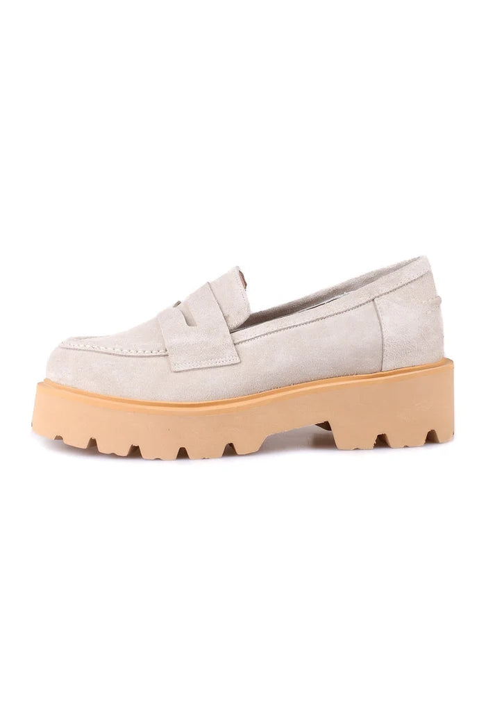 A stylish pair of men's slip-on suede loafers in beige, perfect for any occasion.