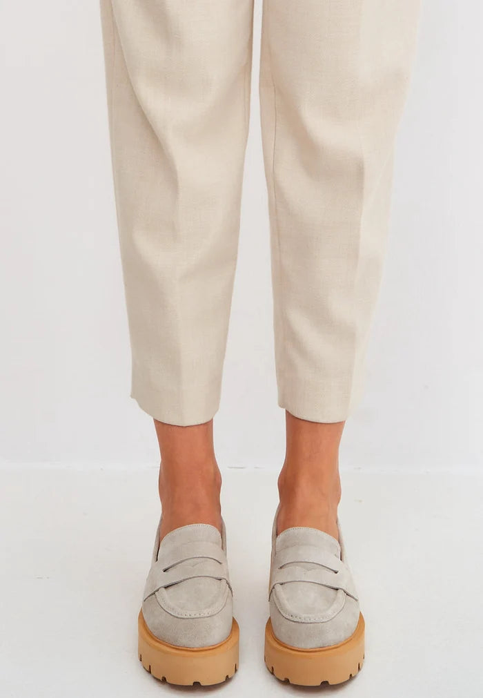 A sleek and stylish pair of slip-on suede loafers in beige, ideal for men's footwear fashion.