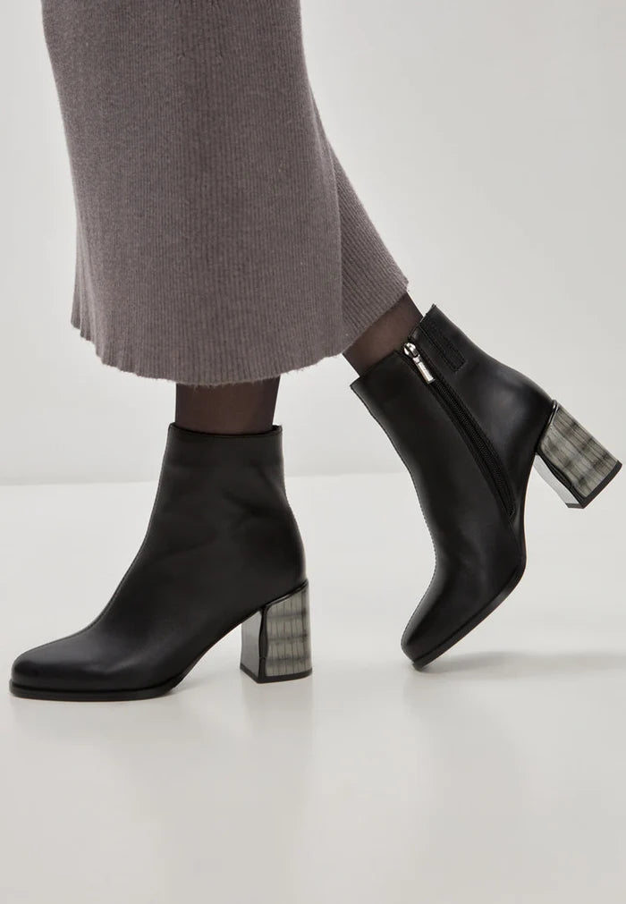 A pair of stylish women's black leather heel boots, known as Ella boots, crafted from soft leather.