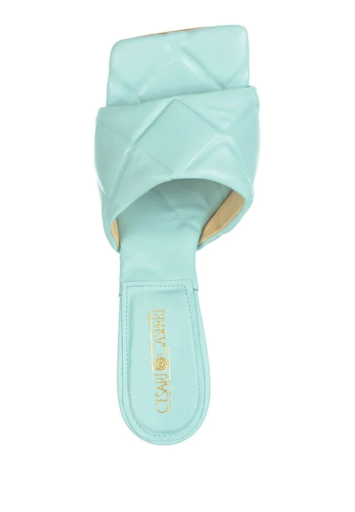 A stylish blue leather square toe heel mule with a chunky heel for women.