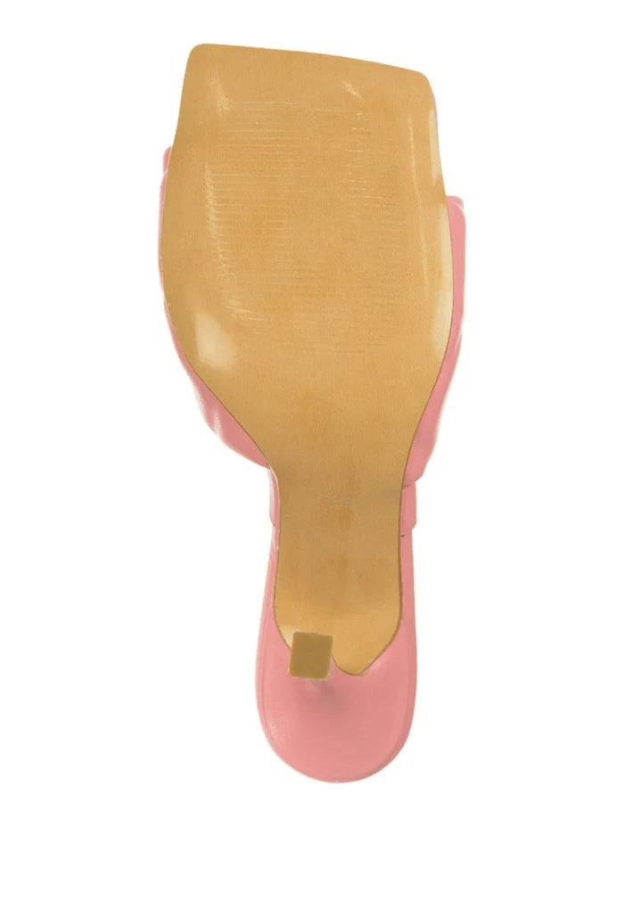 A fashionable pink heeled mule with a square toe, showcasing the trendy square toe heel trend in women's fashion footwear.