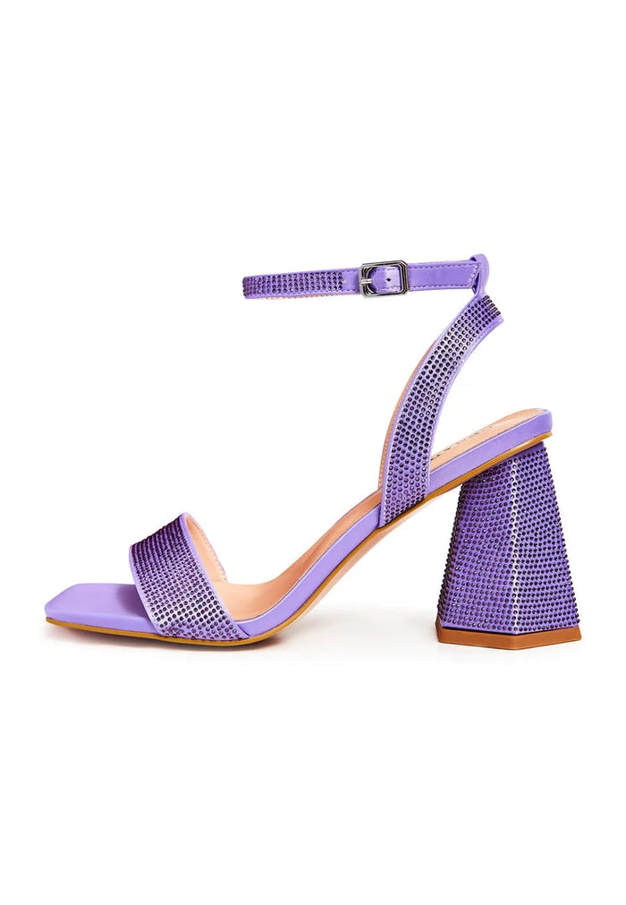 A pair of elegant lilac strappy block heel sandals adorned with sparkling rhinestones, perfect for a glamorous evening out.