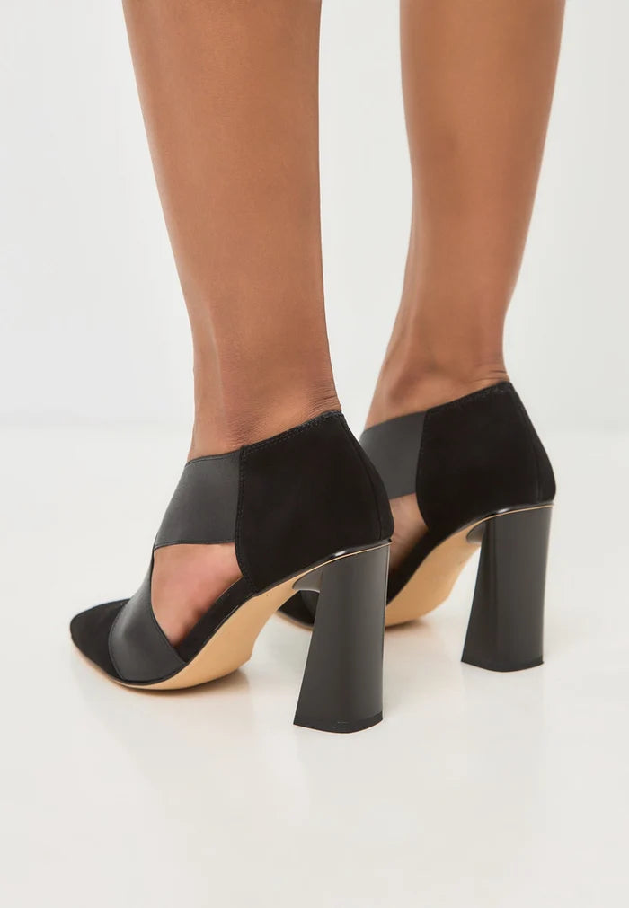 A chic pair of black strappy high heels with block heels, perfect for any occasion.