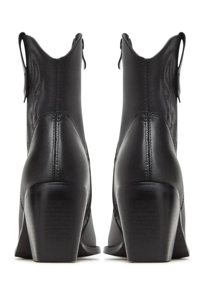 A stylish pair of brown suede ankle boots, a staple for any trendy and fashionable wardrobe.